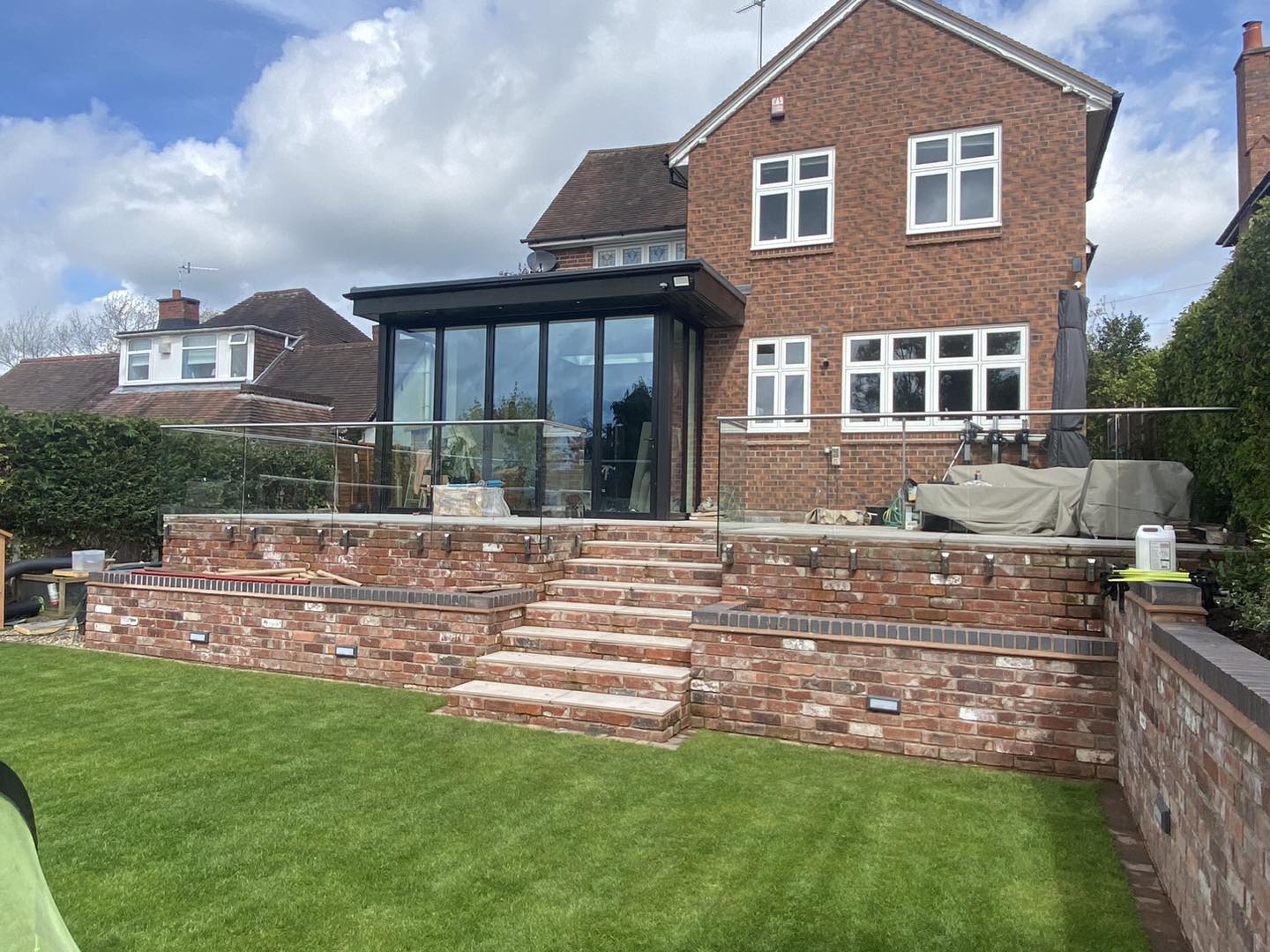 Rear extension with glass balustrade and garden