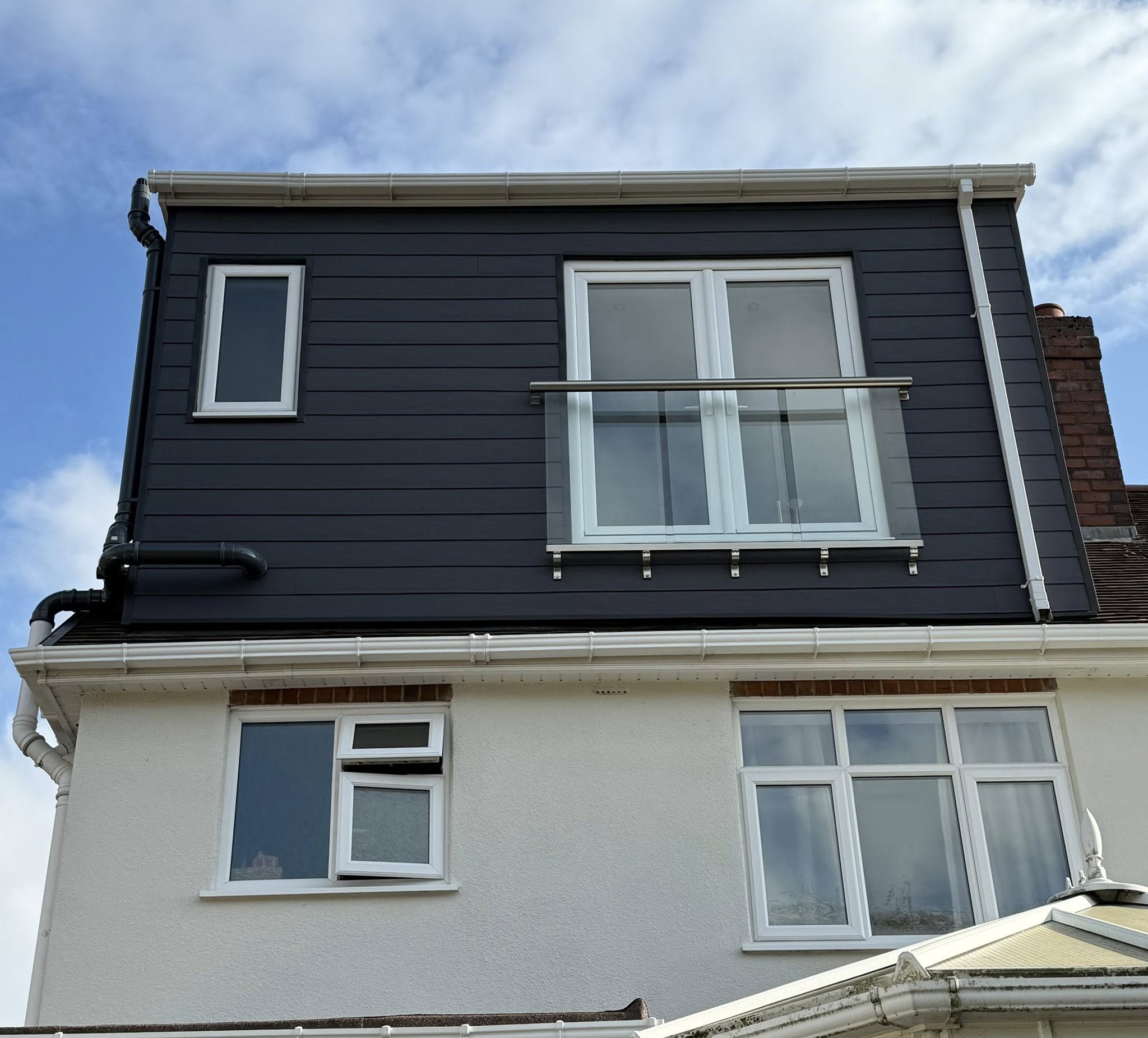 Completed loft conversion with black cladding