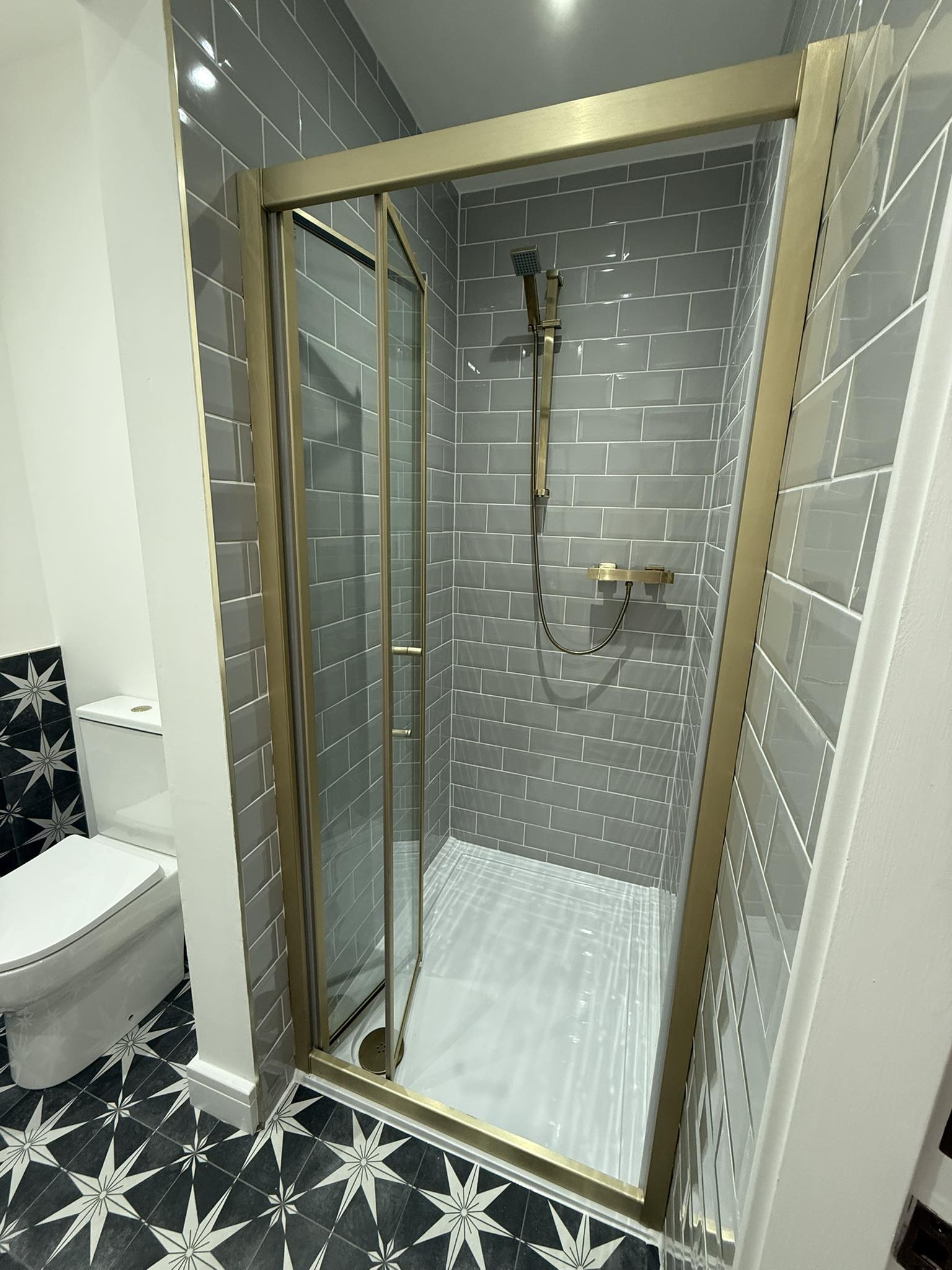 Gold frame shower enclosure bathroom